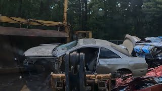 Crushed 2 door Honda accord and destroyed camaro convertible