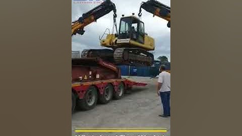 Lifting and loading Komatsu Excavator PC400 on 40 Flat Rack Container by 2 cranes