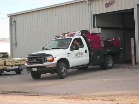 Curtis Volunteer Fire Department responding to a report of a combine on fire.