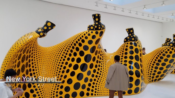 Yayoi Kusama Sculpture Peers Over Champs Elysées Louis Vuitton