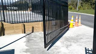 Security gate. sloped bottom. stepped top. rising hinge. hydraulic motor.