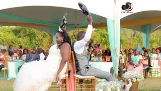 Kenyan Wedding: Beautiful couple play the Shoe Game on their day Kenyan Wedding: Beautiful couple play the Shoe Game on their day