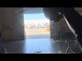 POV backing a semi into a dark building