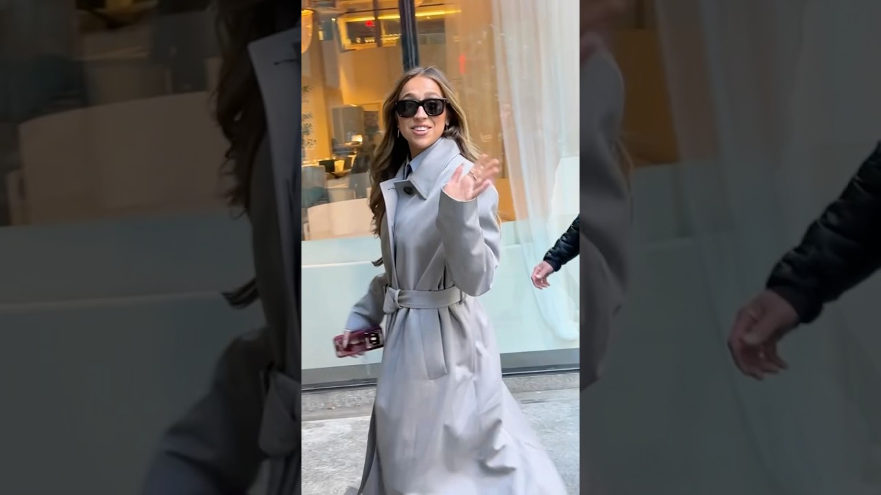 Tate McRae gets ready for spring wearing red pants and a Trench coat! 