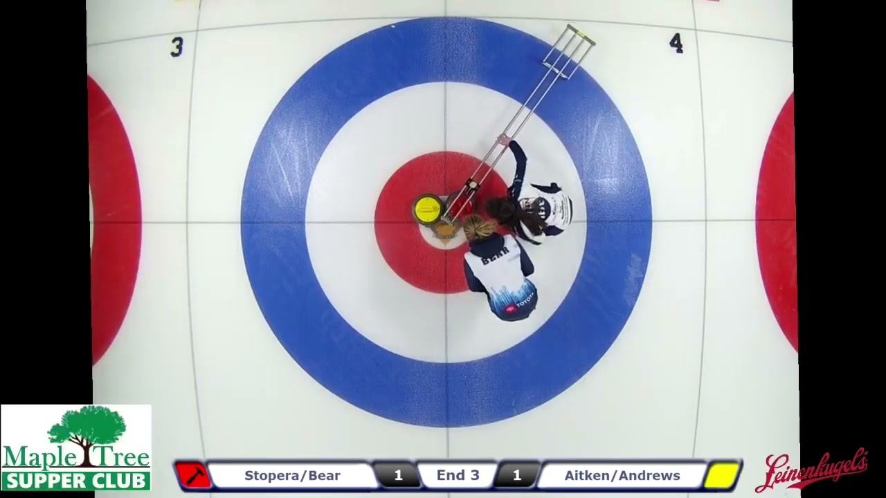 Oopsie! Gina Aitken shows why you don't measure curling rocks from the outside edge!