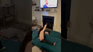 Girl does front flip on gymnastics mats and accidentally kicks little girl on head in living room