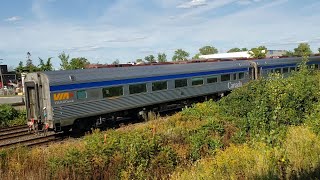 TRAINS via Rail LRC With Extra Budd Coaches Passes Waiting CP Freight at Dorval  Ramps