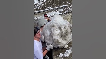 Throwing giant rock off bridge