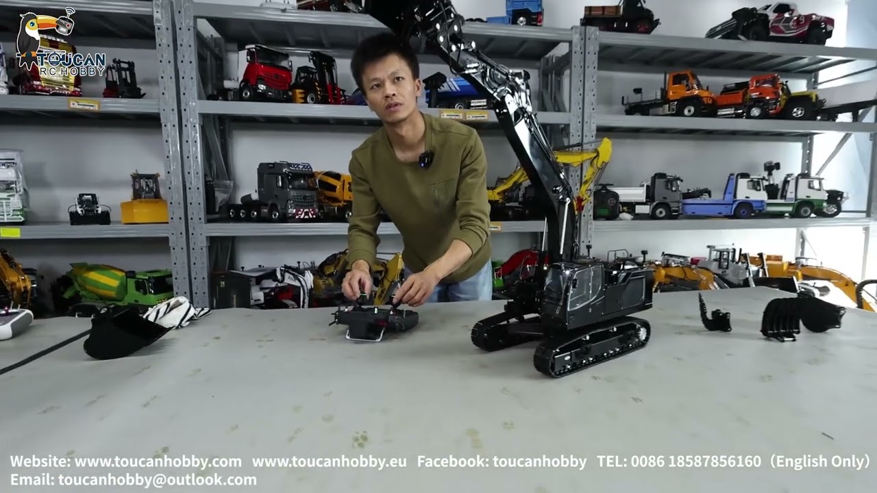 Customized shinny black LESU 945 excavator, with different hydraulic attachments.