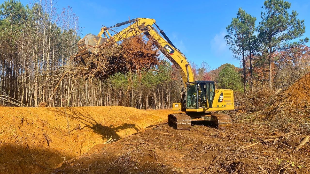 Clearing land with the CAT 320! - YouTube
