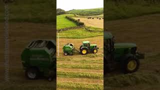 John Deere and Massey Ferguson 390T tractor baling grass for silage McHale round baler #short