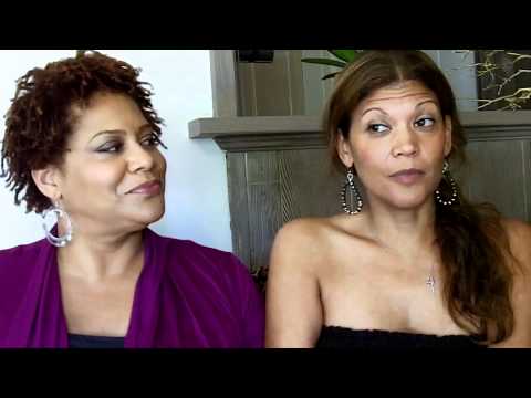 KIM COLES speaks Spanish with her amiga AIDA RODRIGUEZ