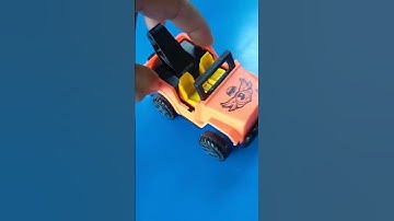 Orange car and dump truck