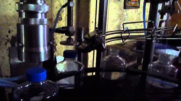 AUTOMATIC ROTARY DECAPPING LIQUID FILLING & SCREW CAPPING MACHINE