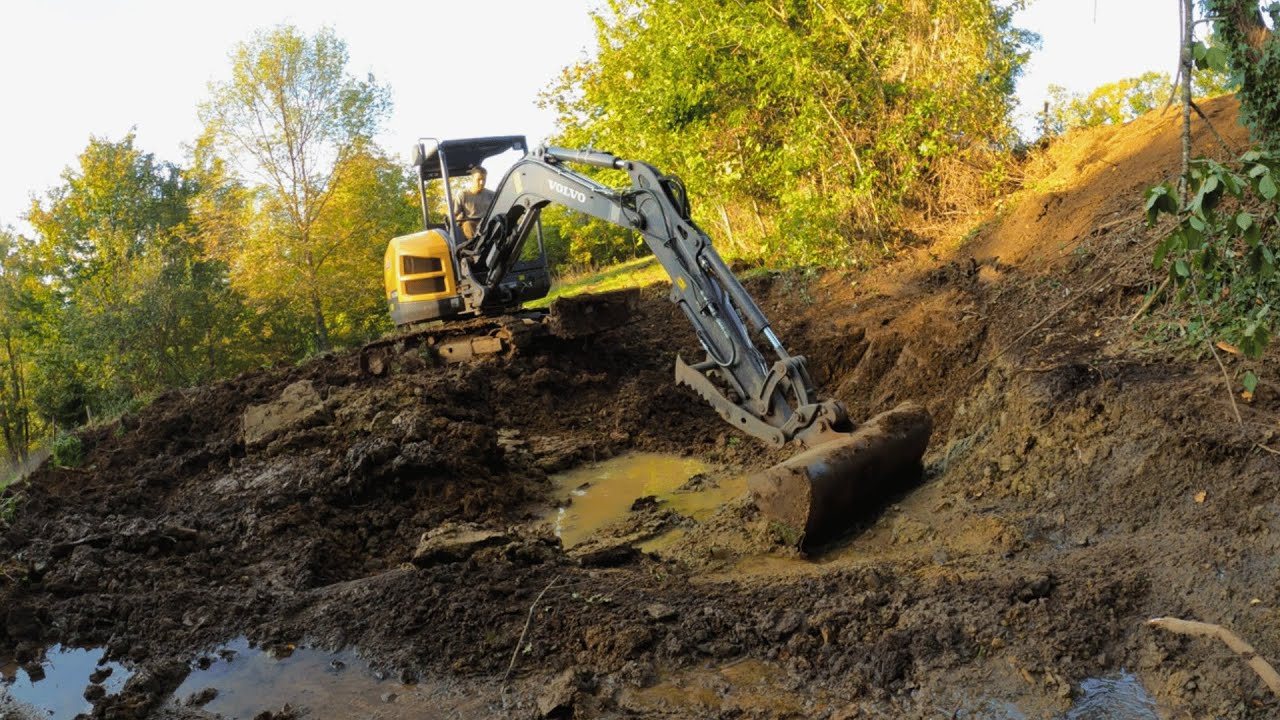 Digging a pond with an excavator - YouTube