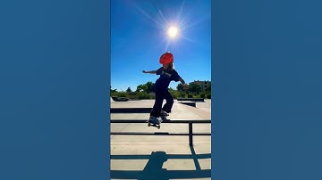 Skateboard frontside boardslide on a rail
