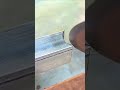 Worker welds metal carefully showing precise welding method