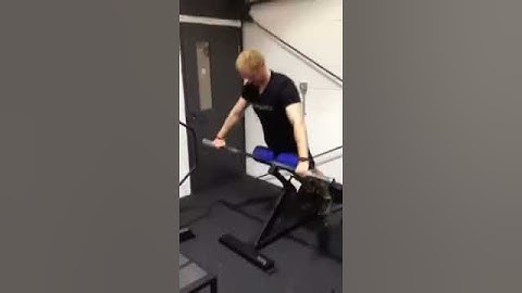 Back extensions with 10kg bar