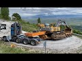 Transporting the volvo ec650 excavator and the caterpillar 235  fasoulas heavy transports