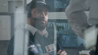 Security officer in headset drinks coffee