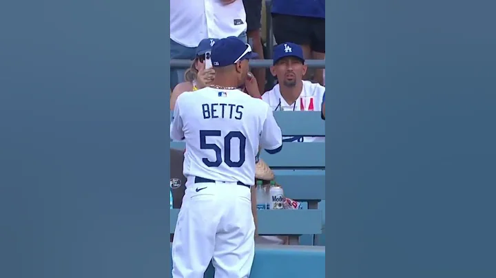 Getting a bat from Mookie Betts after a Dodgers' w...