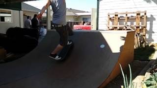 Slow-mo Smith revert on a mini half pipe