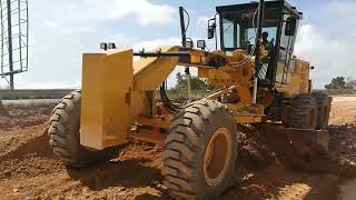 Caterpillar Grader is pushing gravel material so fast.
