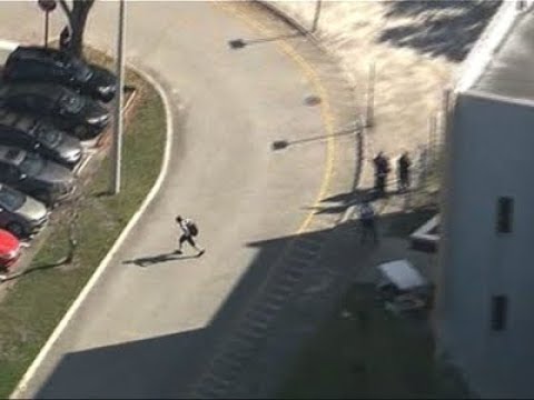 Students flee Florida high school after shooting - Students flee Florida high school after shooting
