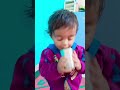 Cute boy first time drinking water from glass