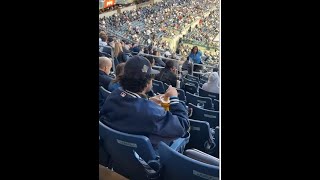 Man at a baseball game dips his hotdog in beer screenshot 5