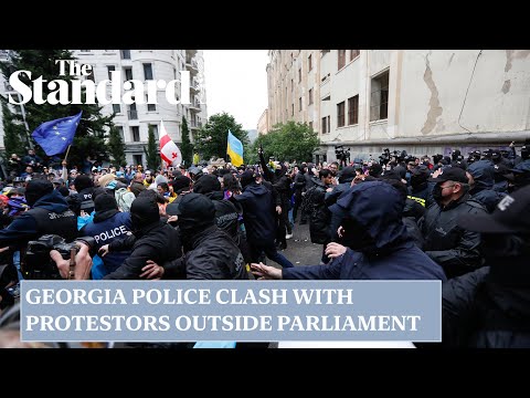 Georgia police face off with protesters gathered outside parliament