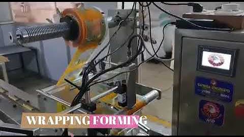 PEANUT CHIKKI BAR HIGH SPEED PACKING FLOW WRAPPING MACHINE MANUFACTURERS BEST PRICE IN INDIA.