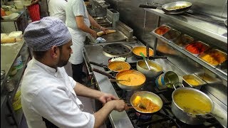 The Heat of the Curry Master's Kitchen on a Busy Friday Night at Shambhala Village Indian Restaurant