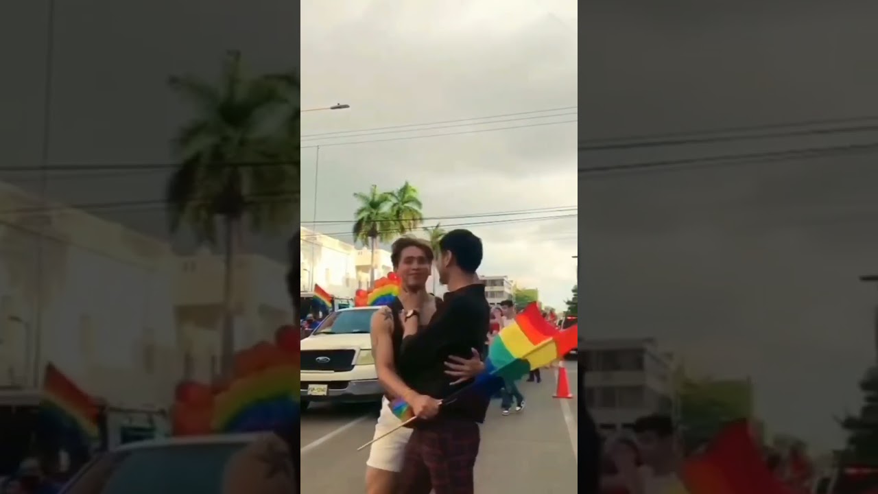 Two men share a tender kiss – then things change. A belt adds tension. 