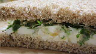 Egg and cress salad sandwich consisting of a chopped, hard boiled
mixed with mayonnaise topped fresh in soft white farmhouse bread...