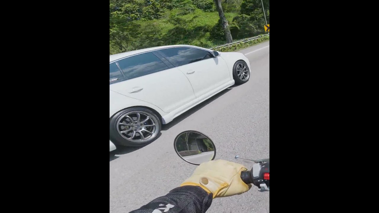A Singaporean Volkswagen Jetta passed another rider dangerously close earlier today without care...