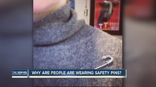 Why are people wearing safety pins?