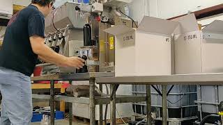 Bottling line with one person. Four Paws Winery