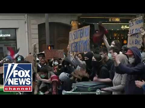 Riot police CONFRONT student protesters in France as clashes escalate