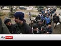 Ukraine Invasion: Volunteers queue to join Ukrainian army