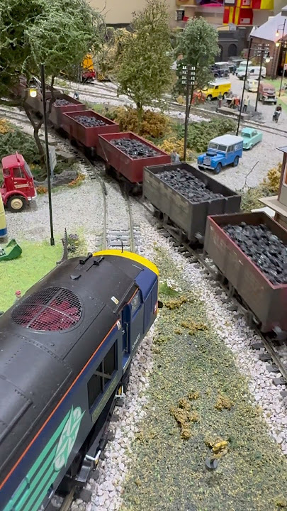 Crossing the country road  A.H. Peppercorn pulling a heavy coal train.