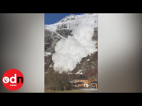 Dramatic moment avalanche hurtles towards village