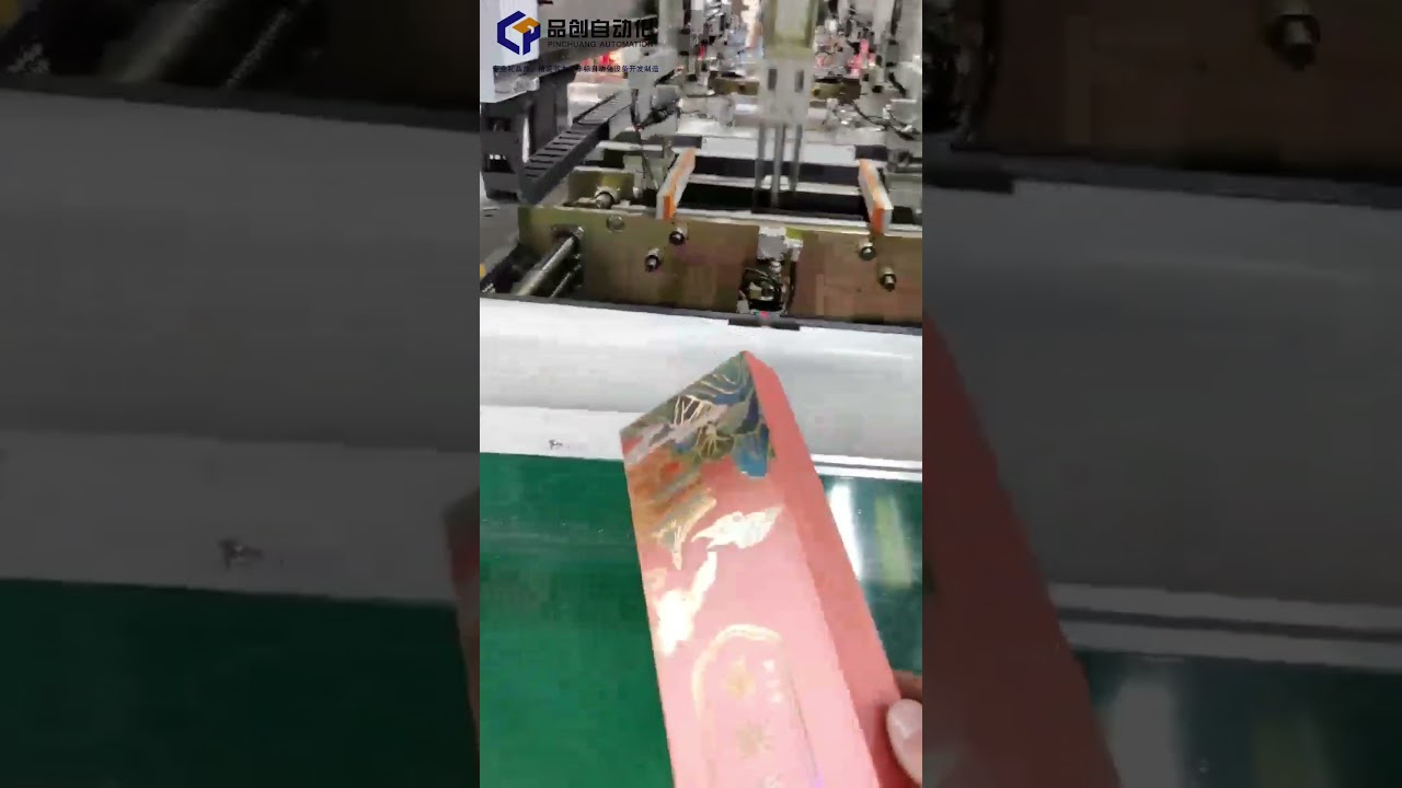 Fully automatic rigid box making machine.