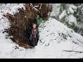 Fallen tree shelter winter snow storm survival bow drill fire