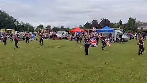 Flagacise entering the arena at Warton carnival Ju...