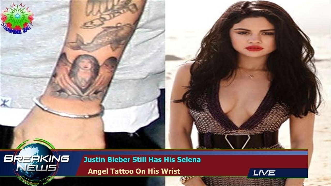 Justin Biebers Tattoos A Selena Gomez lookalike a Crown Jesus Ink  and More