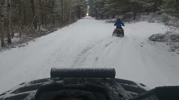 Ryker riding his wheeler in the snow