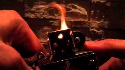 Slow motion lighter sparks flame