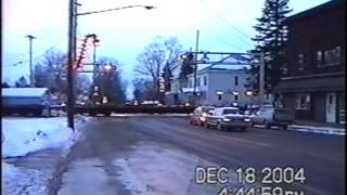 Empty Flatcar Train in Lacona NY with CSX and KCS Power.  12-18-2004