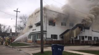 Firefighters battle a blaze at an apartment building in Bay City's South End, April 19, 2016